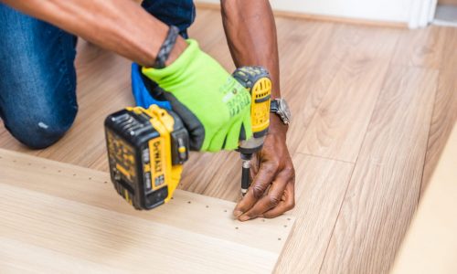 person-holding-dewalt-cordless-hand-drill-1249610-scaled.jpg CARPENTER